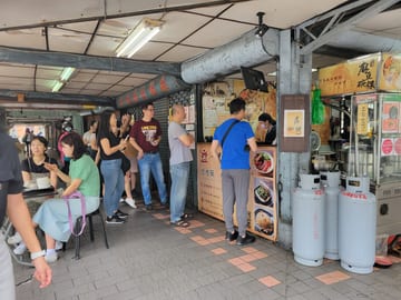 Customers lined up outside a popular Taipei food stall